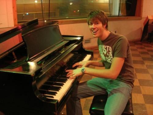 Josh playing the King of Rock and Roll's piano.
