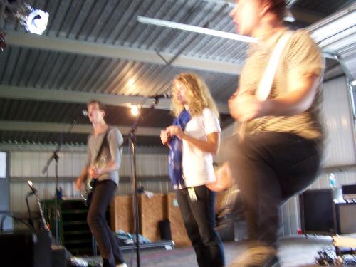 I wish I had better pics of the singer. I took this pic I have my permission to use it.